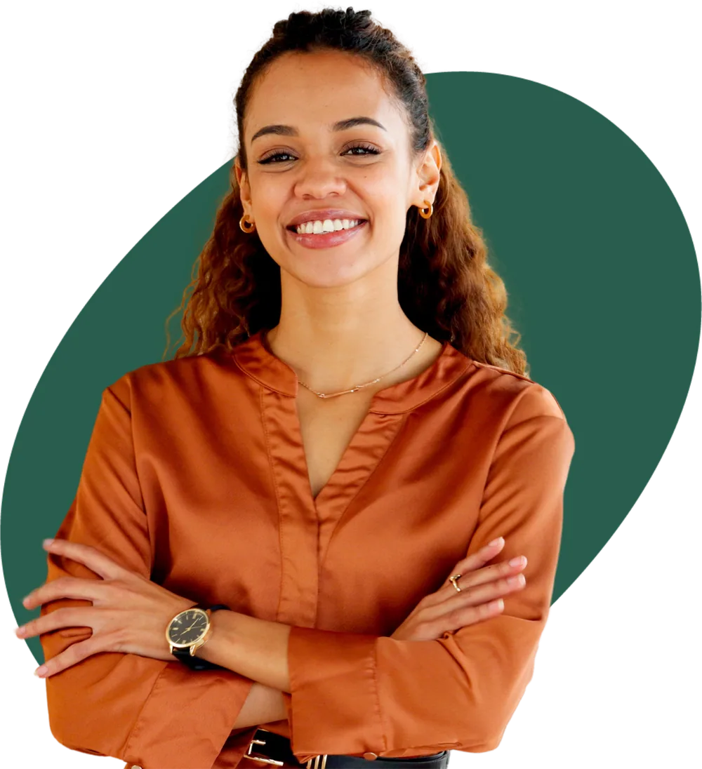 A smiling professional with arms folded